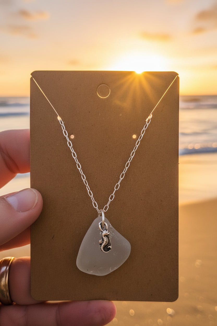 Necklace with a seaglass pendant and Fine Silver seahorse charm with Sterling Silver Chain on a beach sunset background