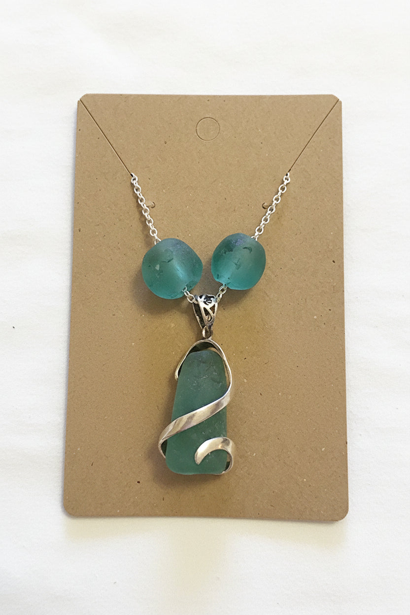 Authentic North East English coastal turquoise sea glass pendant, cradled in a sterling silver wrap and accented with Ghana glass beads on a sterling silver chain