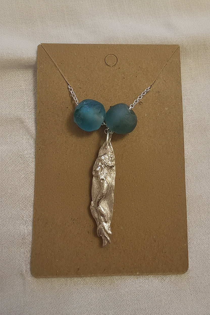 Fine silver handmade mermaid pendant on a sterling silver chain, accented with recycled Ghana glass beads.