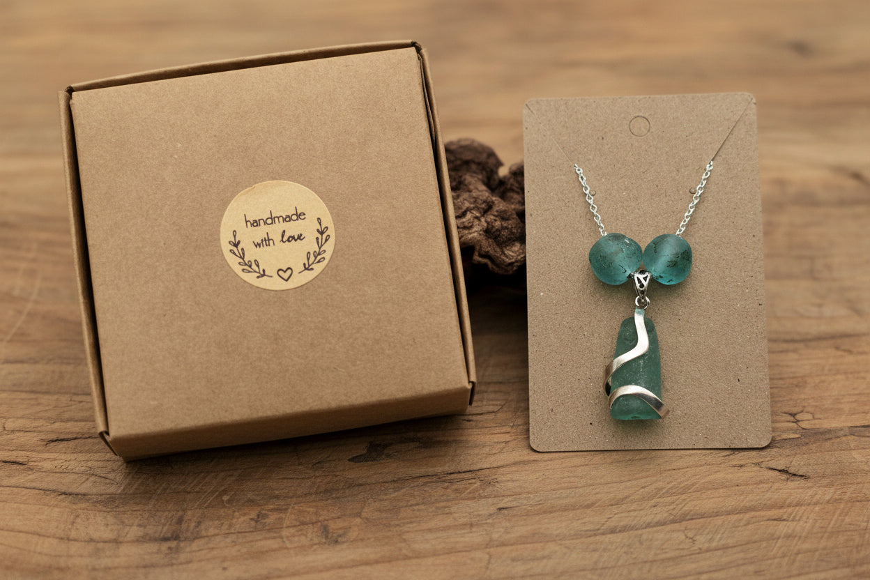 Authentic North East English coastal turquoise sea glass pendant, cradled in a sterling silver wrap and accented with Ghana glass beads on a sterling silver chain